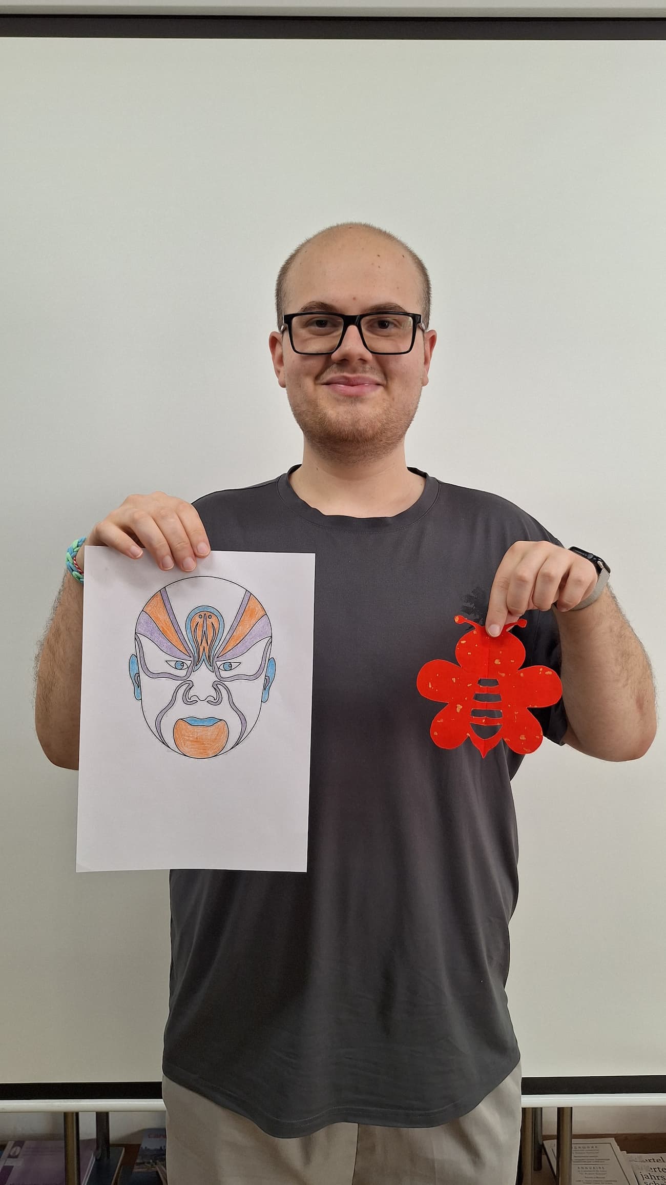 Photo 2: Display of opera masks and paper-cutting